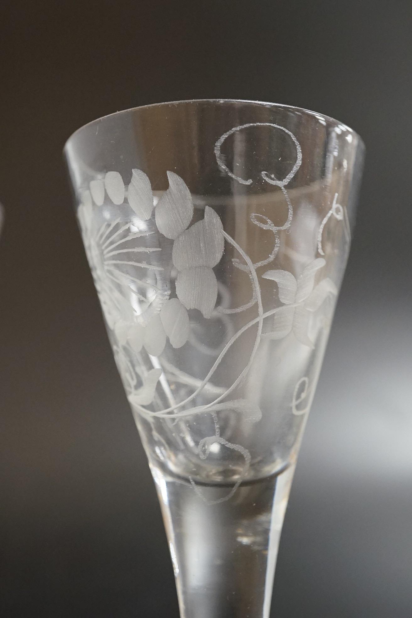 Two George III firing glasses, one with DSOT stem, together with a gin glass with engraved bowl, tallest 11.5cm high (3)